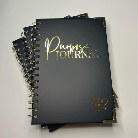 Midnight Black front hardcover with a smooth finish features the word "Purpose Journal" stamped in gold.